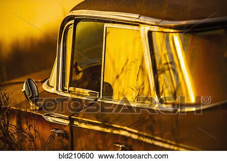Stock Image - Vintage car parked outdoors. Fotosearch