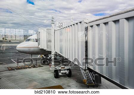 Walkway to airplane on runway View Large Photo Image Stock Image - Walkway to airplane on runway. Fotosearch