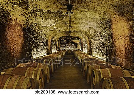 Wine barrels in cave cellar View Large Photo Image Stock Photo - Wine barrels in cave cellar. Fotosearch