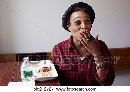 Stock Photo - Woman gasping in cafe. Fotosearch