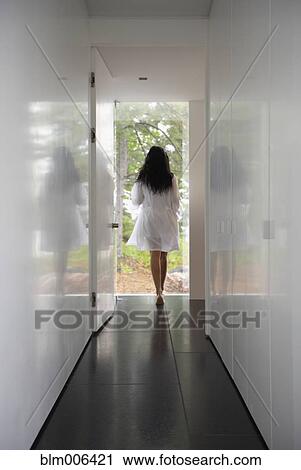 Woman in bathrobe walking outside View Large Photo Image Stock Image - Woman in bathrobe walking outside. Fotosearch