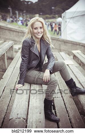 Stock Photo - Woman smiling at festival. Fotosearch