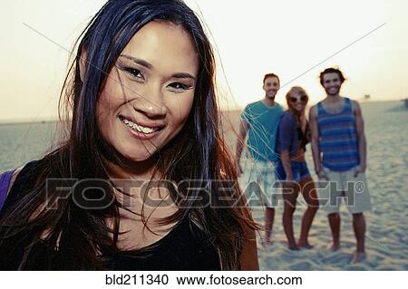 Woman smiling on beach View Large Photo Image Stock Image - Woman smiling on beach. Fotosearch