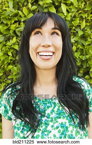 Woman smiling outdoors View Large Photo Image Stock Photography - Woman smiling outdoors. Fotosearch