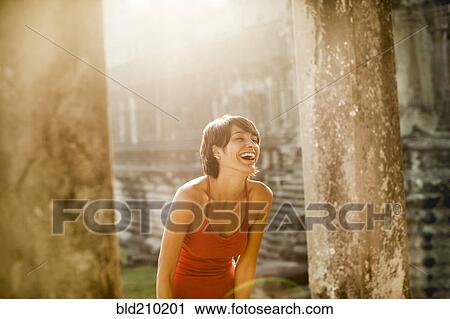 Woman visiting ancient temple, Angkor, Siem Reap, Cambodia View Large Photo Image Stock Image - Woman visiting ancient temple, Angkor, Siem Reap, Cambodia. Fotosearch
