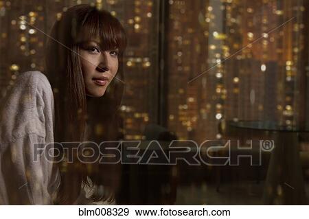 Stock Photo - Woman wearing bathrobe. Fotosearch