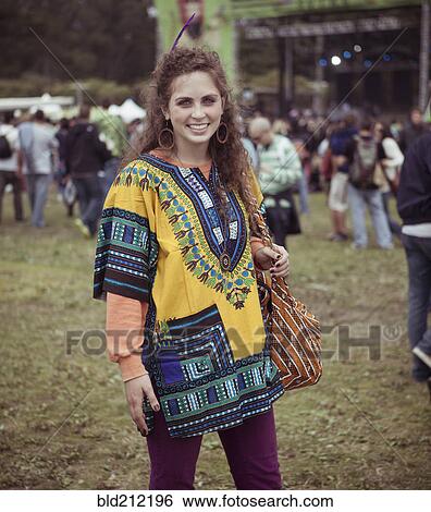 Stock Photograph - Woman wearing decorative poncho at festival. Fotosearch