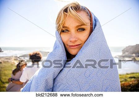 Woman wrapped in blanket on rural hillside View Large Photo Image Stock Photo - Woman wrapped in blanket on rural hillside. Fotosearch