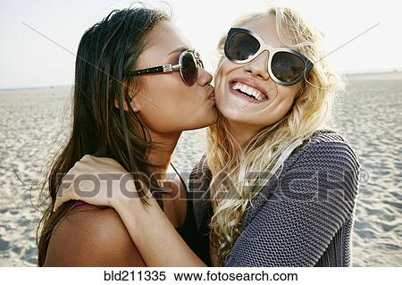 Women kissing on beach View Large Photo Image Stock Photography - Women kissing on beach. Fotosearch
