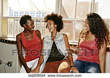 Picture - Women laughing together. Fotosearch