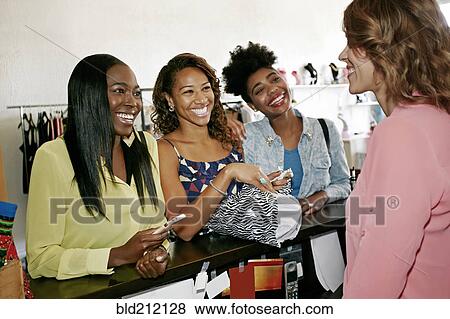 Stock Photo - Women shopping in store. Fotosearch