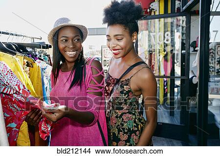 Women shopping on city street View Large Photo Image Picture - Women shopping on city street. Fotosearch