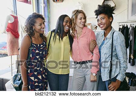 Women shopping together in store View Large Photo Image Stock Image - Women shopping together in store. Fotosearch