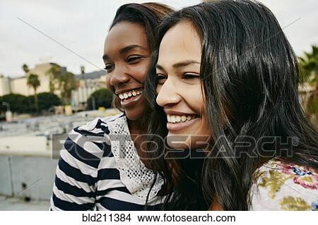 Women smiling on urban rooftop View Large Photo Image Picture - Women smiling on urban rooftop. Fotosearch