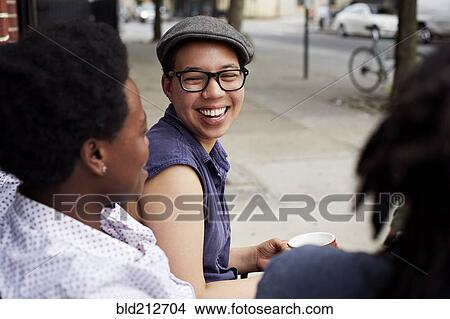 Women talking on city street View Large Photo Image Picture - Women talking on city street. Fotosearch
