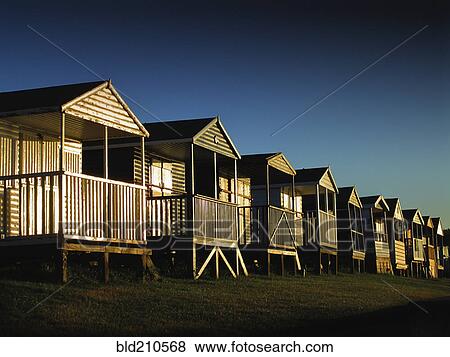 Wooden beach huts in a row, Whitsable, Kent, United Kingdom View Large Photo Image Stock Photo - Wooden beach huts in a row, Whitsable, Kent, United Kingdom. Fotosearch