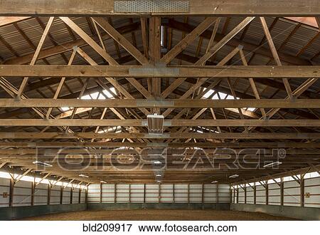 Wooden rafters in indoor horse riding ring View Large Photo Image Stock Photo - Wooden rafters in indoor horse riding ring. Fotosearch