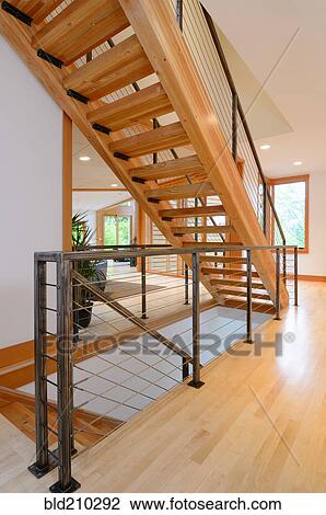 Stock Image - Wooden staircase in modern home. Fotosearch