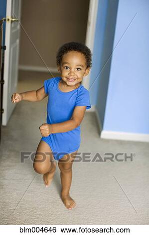 Young mixed race boy running View Large Photo Image Stock Photograph - Young mixed race boy running. Fotosearch