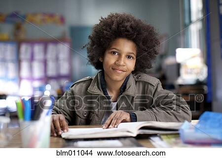 African American boy studying in classroom View Large Photo Image Picture - African American boy studying in classroom. Fotosearch