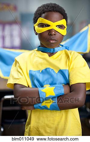 African American boy wearing superhero costume in classroom View Large Photo Image Stock Photo - African American boy wearing superhero costume in classroom. Fotosearch