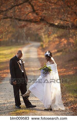 African American bride and groom standing on path View Large Photo Image Stock Image - African American bride and groom standing on path. Fotosearch