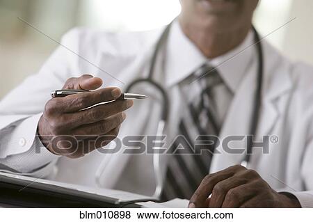 African American doctor writing in medical record View Large Photo Image Stock Photo - African American doctor writing in medical record. Fotosearch