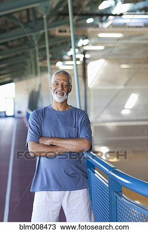 African American man standing in health club View Large Photo Image Stock Image - African American man standing in health club. Fotosearch