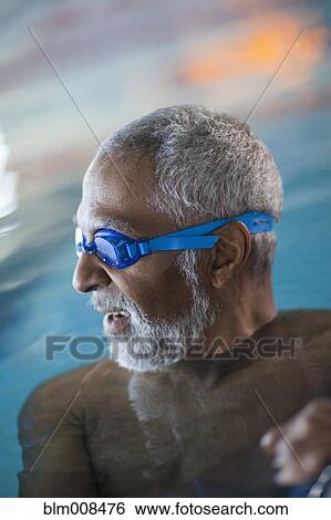 African American man swimming in swimming pool View Large Photo Image Stock Photograph - African American man swimming in swimming pool. Fotosearch