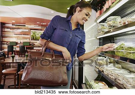 African American woman choosing food in deli View Large Photo Image Stock Photography - African American woman choosing food in deli. Fotosearch