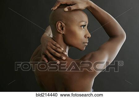 African American woman holding her bald head View Large Photo Image Stock Image - African American woman holding her bald head. Fotosearch