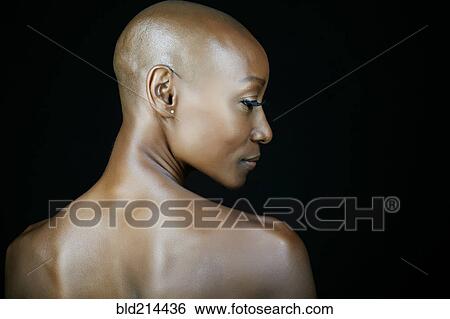 African American woman looking over her shoulder View Large Photo Image Stock Photograph - African American woman looking over her shoulder. Fotosearch