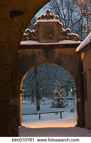 Arch and park in snow covered village View Large Photo Image Stock Image - Arch and park in snow covered village. Fotosearch