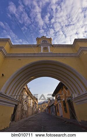 Arch and street in quaint town View Large Photo Image Stock Image - Arch and street in quaint town. Fotosearch