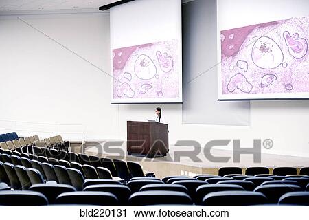 Armenian doctor speaking at podium in empty classroom View Large Photo Image Stock Image - Armenian doctor speaking at podium in empty classroom. Fotosearch