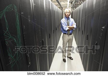 Asian businessman working in office technology room View Large Photo Image Stock Image - Asian businessman working in office technology room. Fotosearch