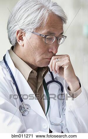 Asian doctor thinking View Large Photo Image Stock Image - Asian doctor thinking. Fotosearch