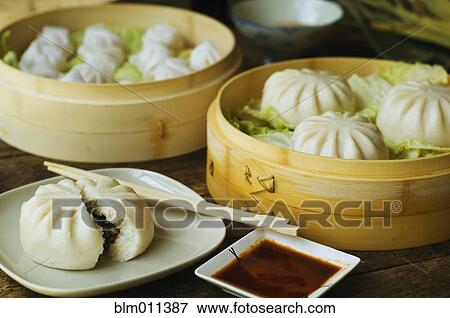 Stock Photo - Asian dumpling in steamer with cabbage. Fotosearch