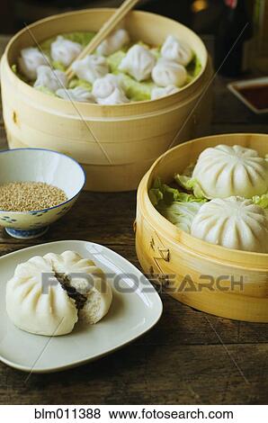 Stock Photo - Asian dumpling in steamer with cabbage. Fotosearch