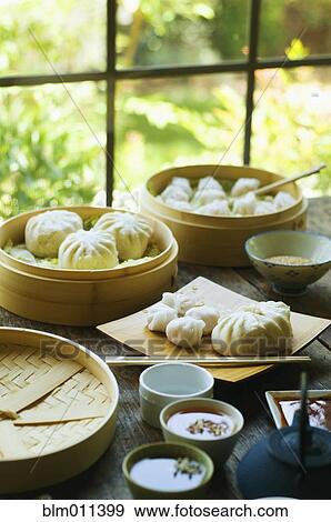 Asian dumpling in steamer with cabbage View Large Photo Image Stock Photo - Asian dumpling in steamer with cabbage. Fotosearch