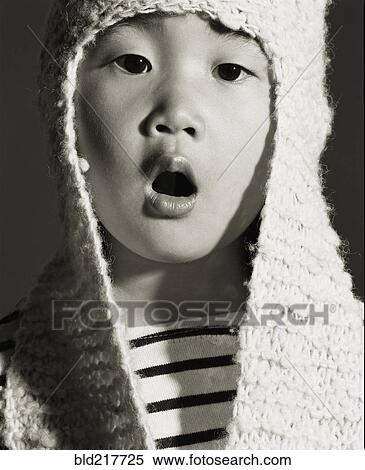 Stock Photography - Asian girl wearing knitted cap. Fotosearch