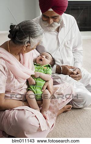 Asian grandparents looking at baby boy View Large Photo Image Stock Image - Asian grandparents looking at baby boy. Fotosearch