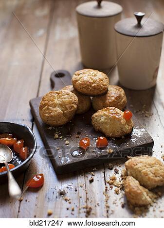 Stock Photo - Biscuits with fruit on board. Fotosearch