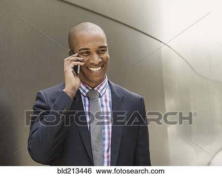 Black businessman talking on cell phone View Large Photo Image Stock Photograph - Black businessman talking on cell phone. Fotosearch