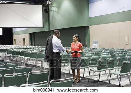 Black businesspeople shaking hands in empty conference center View Large Photo Image Stock Image - Black businesspeople shaking hands in empty conference center. Fotosearch