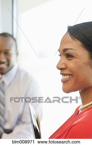 Black businesspeople smiling in office View Large Photo Image Stock Image - Black businesspeople smiling in office. Fotosearch