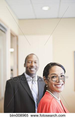 Black businesspeople smiling in office View Large Photo Image Stock Photography - Black businesspeople smiling in office. Fotosearch