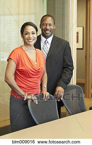 Black businesspeople standing in conference room View Large Photo Image Stock Photograph - Black businesspeople standing in conference room. Fotosearch
