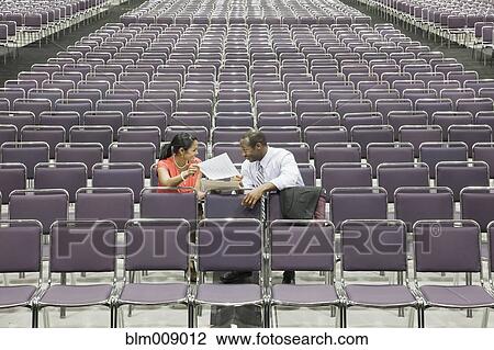 Black businesspeople talking in empty conference center View Large Photo Image Stock Image - Black businesspeople talking in empty conference center. Fotosearch