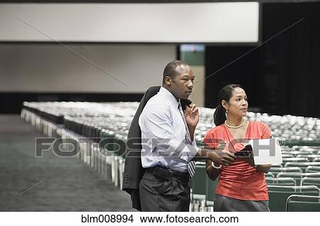 Picture - Black businesspeople talking in conference center. Fotosearch